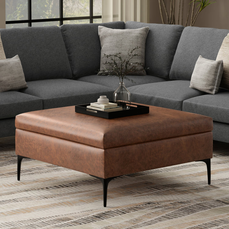 Distressed Saddle Brown Distressed Vegan Leather | Rebecca Coffee Table Storage Ottoman with Lift Up Lid in Distressed Vegan Leather